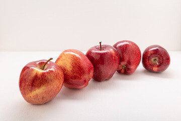 Apples are red-yellow, juicy on a light background