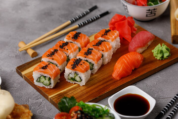 Philadelphia roll with cucumber and sushi with salmon and tuna. Sushi menu. Japanese food.