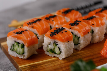 Philadelphia roll with cucumber and sushi with salmon and tuna. Sushi menu. Japanese food.