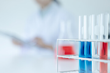 scientist in sterile clothes is making  vaccine drug  and research medical Covid-19 coronavirus vaccine in lab