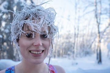 Close up of lady, womans frosty, frozen hair with icicles hanging down from tips. Taken in winter...