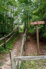 recreational picnic area direction sign and path to the woods