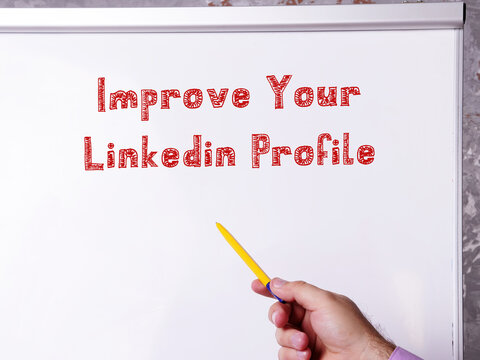 Motivational concept meaning Improve Your Linkedin Profile with phrase on the piece of paper.
