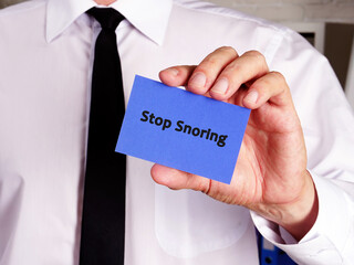 Business concept about Stop Snoring with phrase on the piece of paper. - Powered by Adobe