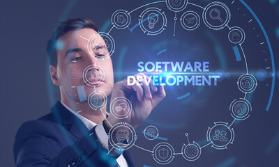 Business, Technology, Internet and network concept. Young businessman working on a virtual screen of the future and sees the inscription: Software development