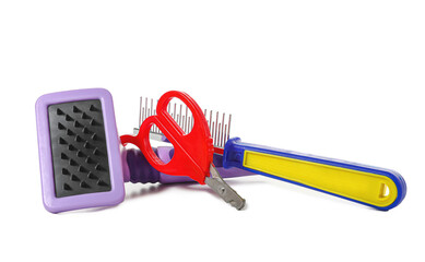 Pet care accessories on white background