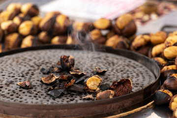 Roasted chestnuts. Street food in Istanbul, Turkey. Shallow depth of field.