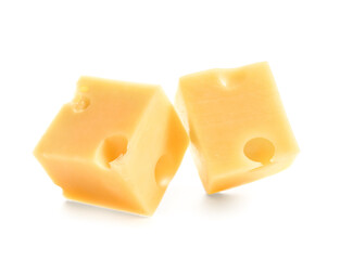 Pieces of tasty cheese on white background