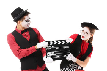Pantomimists with movie clapper on white background