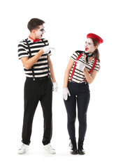 Male and female pantomimists on white background