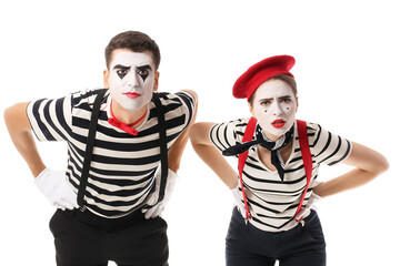 Male and female pantomimists on white background