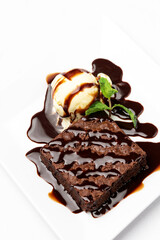 vegan chocolate brownie dessert with dairy-free vanilla ice cream