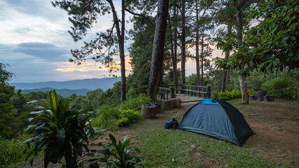 The camping tent on the mountain with sky and tree surrounded