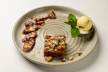Churchkhela served on a ceramic plate over white background. Traditional Georgian dessert.