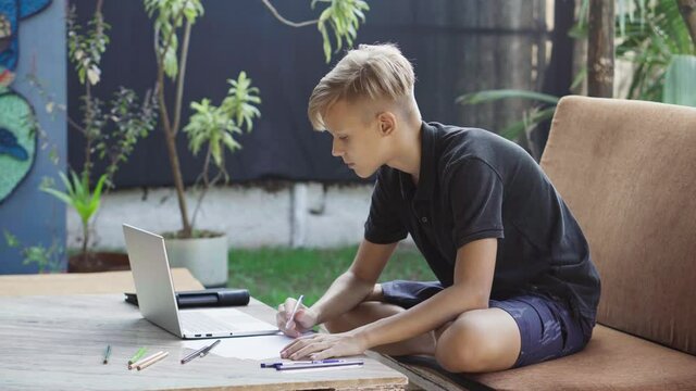 Teenager studying in online school