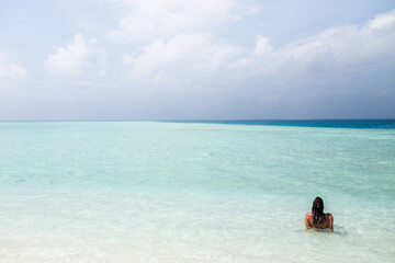 Fototapeta na wymiar Woman relaxing in Maldives