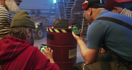 Male fans discussing bets while watching football match on tablet