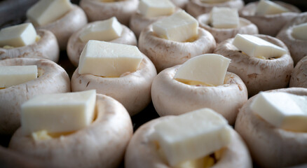 Baked mushrooms champignons with cheese. Cooking process. Home kitchen. Georgian dishes. Close up