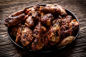 Chicken wings barbeque in a cast iron baking dish