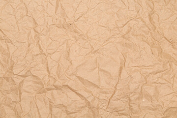 Crumpled brown wrapping paper. Texture and background.