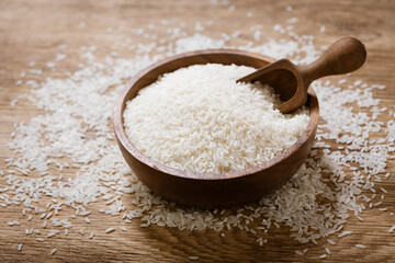 Fototapeta na wymiar raw white rice on a wooden board