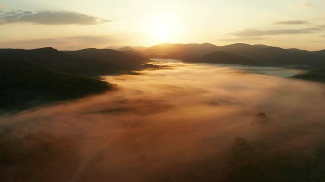 Misty sunrise in the mountains with a beautiful sky. Aerial view. Korcula island, Croatia.
