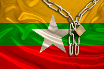 iron chain, a symbol of tyranny, protest against the background of the national flag of Myanmar,...