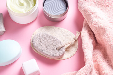 Obraz na płótnie Canvas Bath tools, towel, pumise, cream and soap on toilet table