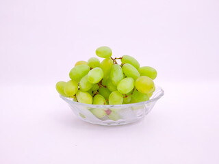 The Fresh Green Grapes In The Glass Bowl with White Baground