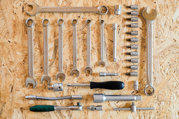 set of various repair hand tools or auto mechanic's tools. repair tool kit. equipment for building. wooden background, pattern, top view