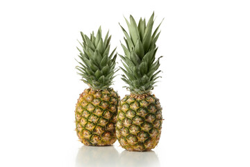 Fototapeta premium Tasty ripe pineapples isolated on white background