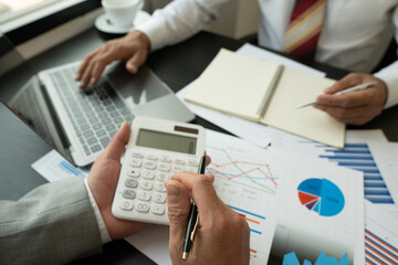 The business team meets for a professional investor meeting working and discussing projects, business strategies, marketing, business finance and accounting concept.