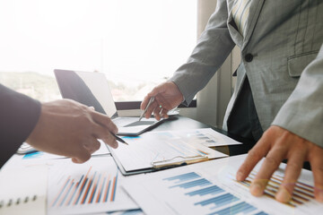 Brainstorming meeting of businessmen working together to come up with a marketing strategy Business finance and accounting concepts