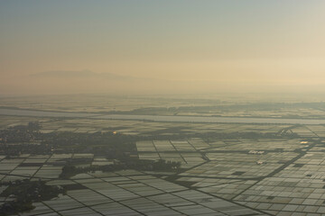 森山から春霞の八郎潟方向の夕景