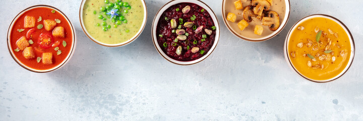 Vegan soup panorama with a place for text. Various vegetable cream soups, top shot
