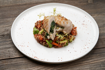 Baked chicken breast with quinoa rice. Healthy food