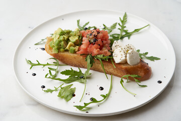 Healthy vegetarian bruschetta with vegetable and cheese.
