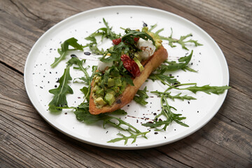 Healthy vegetarian bruschetta with vegetable and cheese.