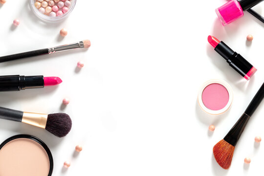 Makeup banner design with copy space. Make-up products and tools, shot from the top on a white background