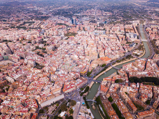 Obraz premium View from drone of residential areas and catholic cathedral belfry of Spanish town of Murcia on Segura river