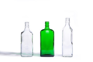 Glass bottles of different shapes isolated on white background