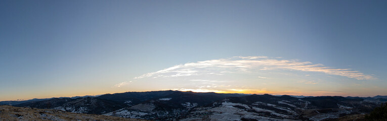Sunset panorama on a winter evening in the Carpathian region