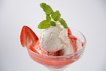 Strawberries with ice cream in glass cup. Summer dessert