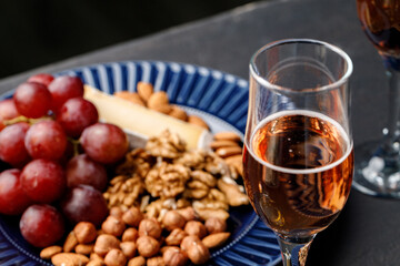 Close up of nuts and grapes on plate