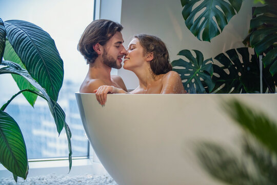 young couple bathes in the bath