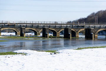 Railway viaduct  standing in frozen flood water