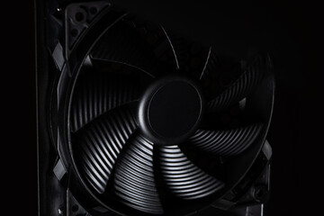 Cose up of computer fan on a dark background