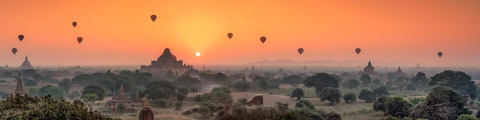 Aerial view of Dhammayangyi temple and hot air balloons at sunrise, Bagan, Myanmar