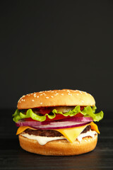 Fresh tasty burger on a dark background