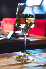 Romantic dinner - glass of white riesling wine